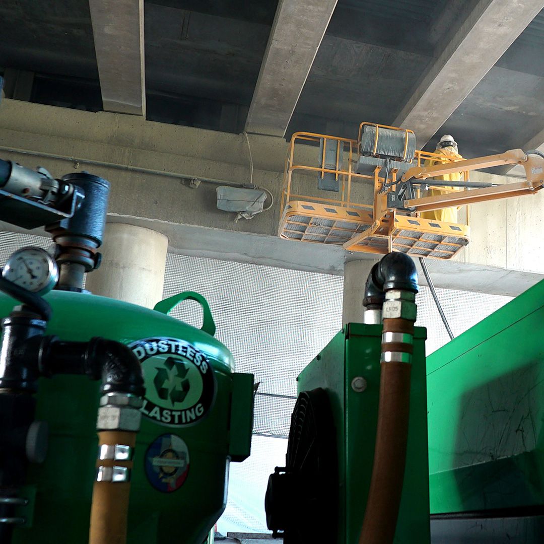 Close-up of dustless blasting equipment in action